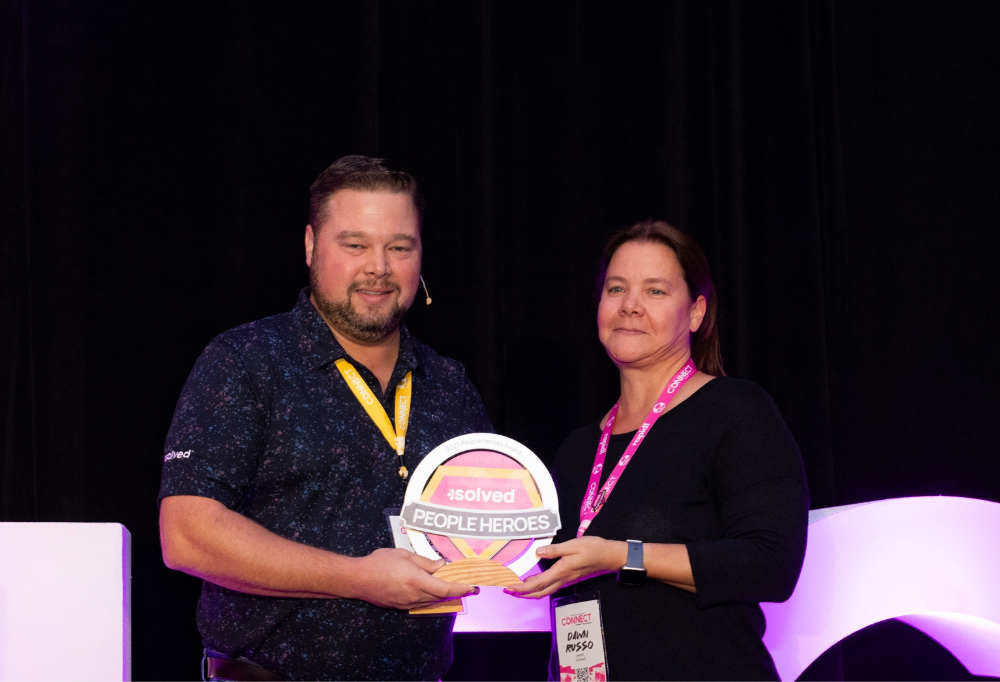 People hero is presented an award at 2023 isolved Connect.
