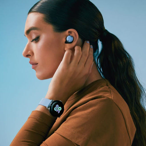 A person wears matching Pixel Buds and Google Pixel Watch 2.
