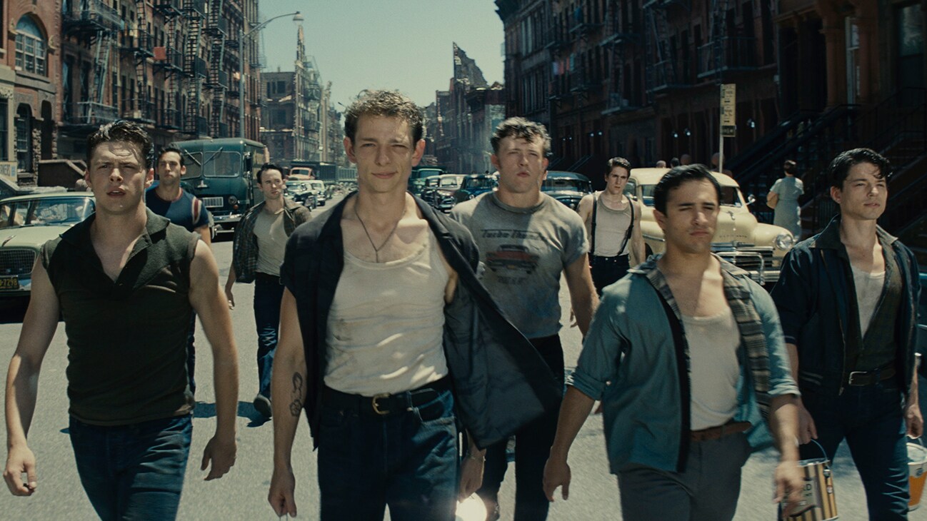 An image of actors Sean Harrison Jones, Patrick Higgins, Jess LeProtto, Kevin Csolak, and Mike Faist walking down a street from the 20th Century Studios movie "West Side Story".
