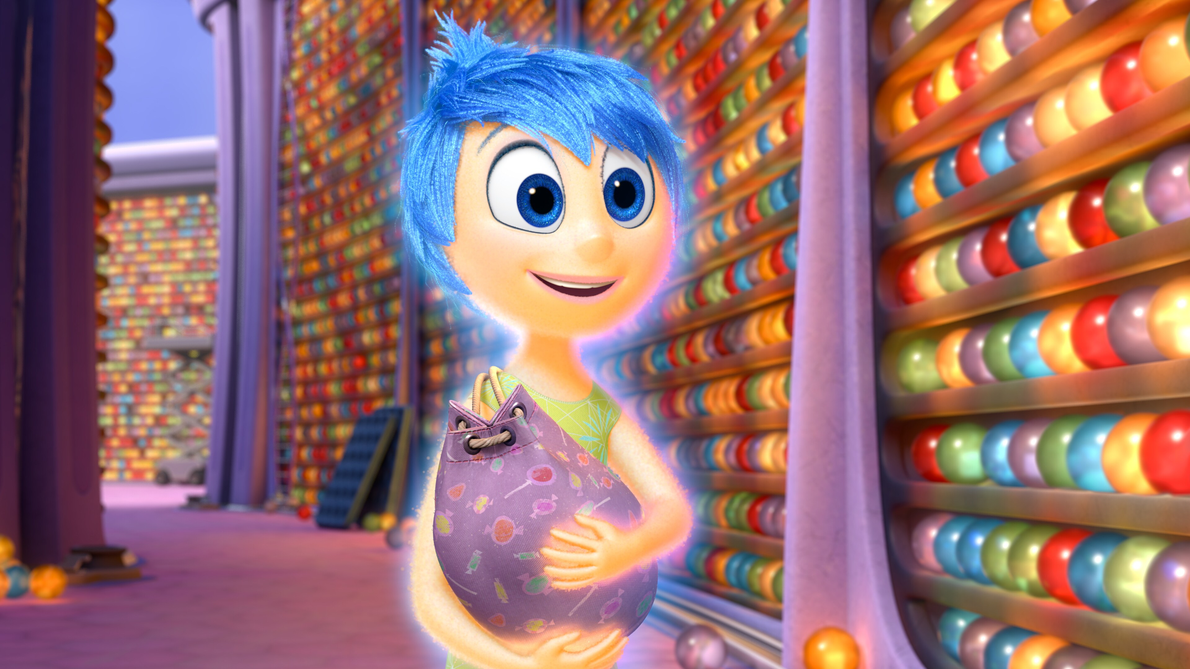 Actor Amy Poehler as Joy holding memories in the movie "Inside Out" 