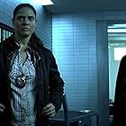 Christian Bale and Monique Gabriela Curnen in The Dark Knight (2008)