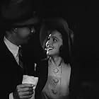 Olivia de Havilland and Dick Powell in Hard to Get (1938)