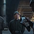 Dan Li, Sule Rimi, and Rob Compton in The Axe Forgets (2022)