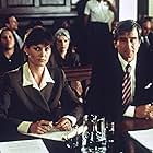 Carey Lowell and Sam Waterston in Law & Order (1990)