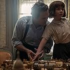 Mark Ruffalo and Nell Sutton in All the Light We Cannot See (2023)