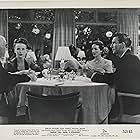 Genevieve Bell, Harry Cheshire, Michael Rennie, and Beatrice Straight in Phone Call from a Stranger (1952)
