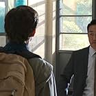 Kenneth Choi and Tom Holland in Spider-Man: Homecoming (2017)