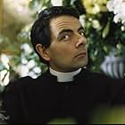 Rowan Atkinson in Four Weddings and a Funeral (1994)
