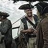 Stephen Graham, Kevin McNally, and Adam Brown in Pirates of the Caribbean: Dead Men Tell No Tales (2017)