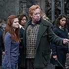 Mark Williams, Bonnie Wright, Carmen Straker, and Jade Stanger in Harry Potter and the Deathly Hallows: Part 2 (2011)