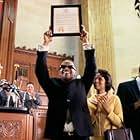 Ray Charles (JAMIE FOXX) is honored by the State of Georgia (with KERRY WASHINGTON as Della Bea Robinson by his side) as "Georgia on My Mind" is declared the official state song in the musical  biographical drama, Ray.