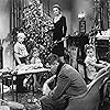 James Stewart, Donna Reed, Carol Coombs, Jimmy Hawkins, and Larry Simms in It's a Wonderful Life (1946)