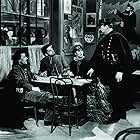 Paul Irving, Paul Muni, Erin O'Brien-Moore, and Vladimir Sokoloff in The Life of Emile Zola (1937)