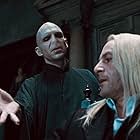 Ralph Fiennes, Jason Isaacs, and Tom Felton in Harry Potter and the Deathly Hallows: Part 1 (2010)