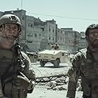 Bradley Cooper and Jake McDorman in American Sniper (2014)