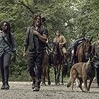 Norman Reedus, Danai Gurira, Tom Payne, Ross Marquand, Josh McDermitt, and Seven in The Walking Dead (2010)