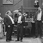 Charles Chaplin, Henry Bergman, Eric Campbell, Edna Purviance, and Janet Sully in The Adventurer (1917)