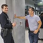 Shawn Christian and Nathan Fillion in The Rookie (2018)