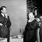 Alfred Hitchcock on teh set of "Rope" wit J. Stewart. 1948 Warner Bros.