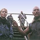 Van Zan (Matthew McConaughey, right), an American mercenary, with his pilot, Alex Jensen (Izabella Scorupco, left) arrives in Britain with the firepower to bring down the beasts.