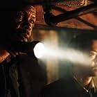 Danny Glover and Ken Leung in Saw (2004)