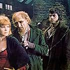 Oliver Reed, Ron Moody, and Shani Wallis in Oliver! (1968)
