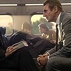 Liam Neeson and Vera Farmiga in The Commuter (2018)