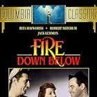 Rita Hayworth, Robert Mitchum, and Jack Lemmon in Fire Down Below (1957)