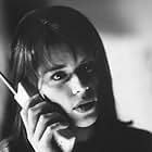 Neve Campbell and Roger Jackson in Scream (1996)