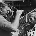 John Wayne and photographer David Sutton on the set of "McQ"