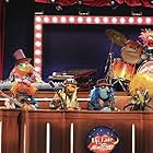 Bill Barretta, Dave Goelz, David Rudman, Matt Vogel, Steve Whitmire, Eric Jacobson, Teeth, Floyd Pepper, Janice, and Electric Mayhem Band in The Muppets. (2015)