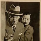 Leonard Mudie and Anna May Wong in When Were You Born? (1938)