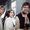 Harrison Ford, Carrie Fisher, and Mark Hamill in Star Wars (1977)