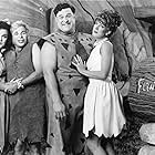 John Goodman, Rick Moranis, Elizabeth Perkins, and Rosie O'Donnell in The Flintstones (1994)