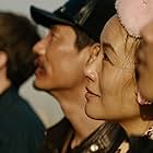 Mason Lee, Vivian Wu, David Rysdahl, and Haoyu Yang in Dead Pigs (2018)