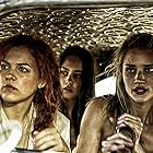 Riley Keough, Rosie Huntington-Whiteley, and Courtney Eaton in Mad Max: Fury Road (2015)