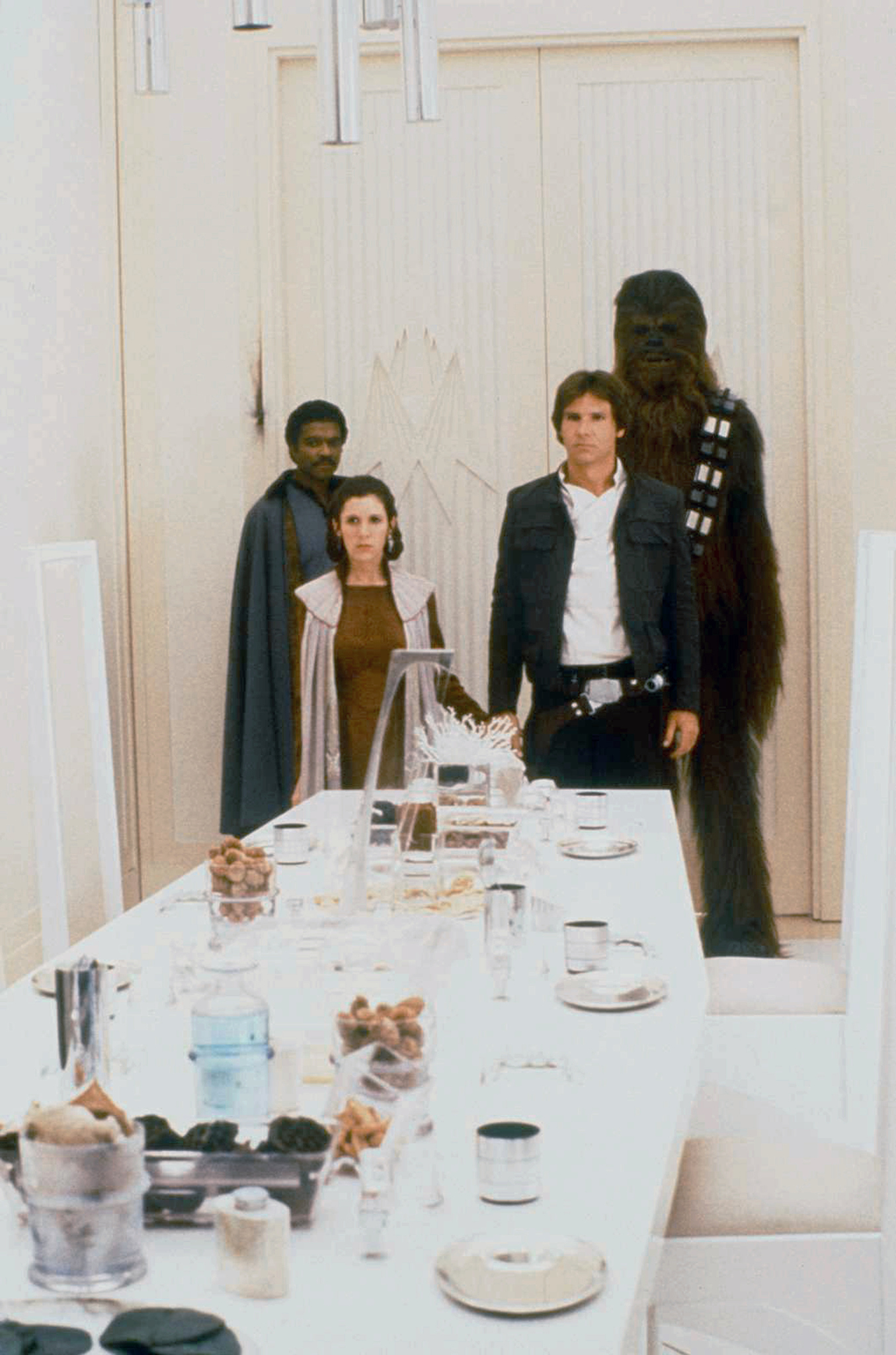 Harrison Ford, Carrie Fisher, Billy Dee Williams, and Peter Mayhew in Star Wars: Episode V - The Empire Strikes Back (1980)