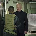 Eugene Byrd and Neal McDonough in Arrow (2012)