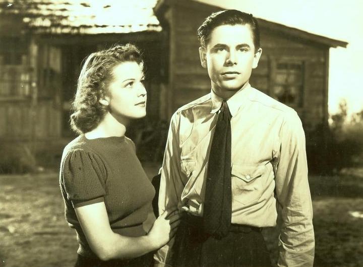 Glenn Ford and Jean Rogers in Heaven with a Barbed Wire Fence (1939)