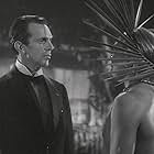 Al Kikume and Raymond Massey in The Hurricane (1937)