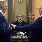 Nicholas Nickleby (CHARLIE HUNNAM) befriends brothers Ned and Charles Cheeryble (GERARD HORAN, left, and TIMOTHY SPALL, right) 