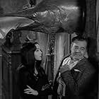 Carolyn Jones and Eddie Quillan in The Addams Family (1964)