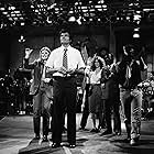John Belushi, Jane Curtin, Garrett Morris, Laraine Newman, and Fred Willard in Saturday Night Live (1975)
