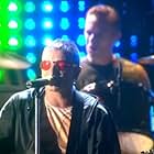 Bono, Larry Mullen Jr., and U2 in U2: PopMart Live from Mexico City (1997)