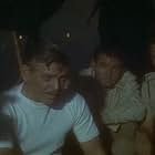 Clark Gable, Gene Barry, Michael Rennie, and Frank Tang in Soldier of Fortune (1955)