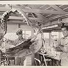 Victor Mature and Philip Coolidge in The Sharkfighters (1956)