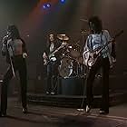 Brian May, Freddie Mercury, John Deacon, and Queen in Queen: Live at the Rainbow (1992)