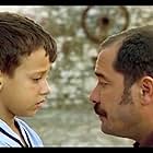 Fikret Kuskan and Ege Tanman in My Father and My Son (2005)