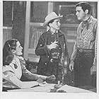Robert 'Buzz' Henry, Robert Kellard, and Peggy Stewart in Tex Granger: Midnight Rider of the Plains (1948)