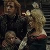 Helena Bonham Carter, Sacha Baron Cohen, Amanda Seyfried, and Isabelle Allen in Les Misérables (2012)